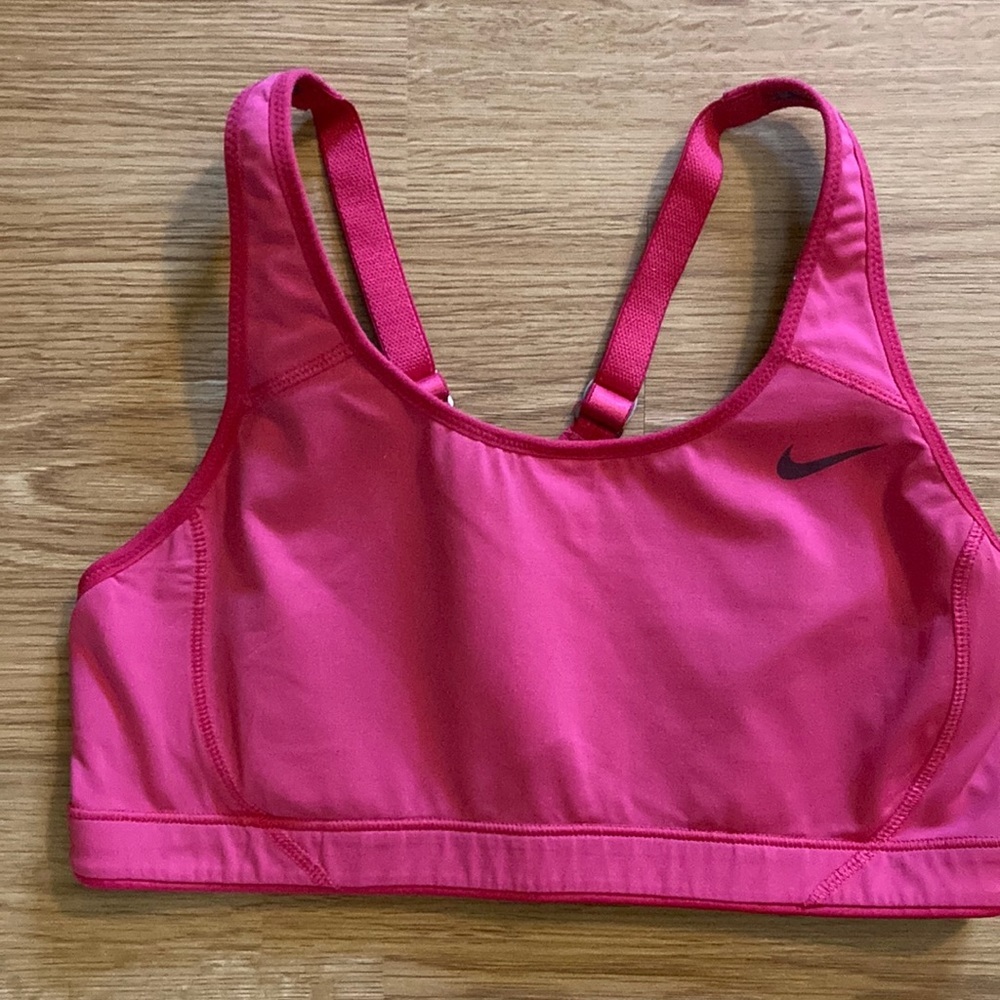 Nike unlined sports bra-hot pink color. Size M. Adjustable straps. Racerback